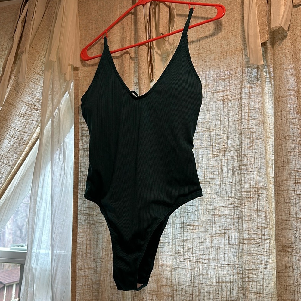 never been worn Teal one piece swim suit